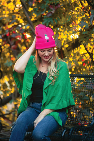 Hot Pink knit hat with embroidered nutcracker on model