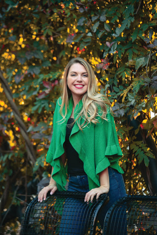 woman wearing green metalic ruffle wrap