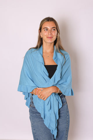 woman wearing ava ruffle wrap in opal blue