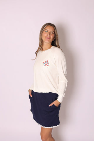 Seasonal Stitch Top with red, white, and blue firework embroidery, styled with navy skirt.