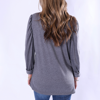 Black puffed long sleeve top (back view)