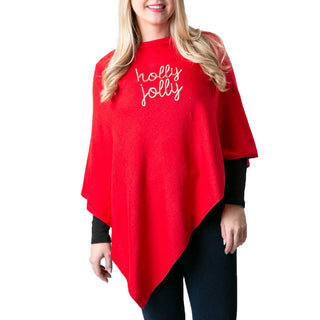 holly jolly in gold embroidered script letters on red knit poncho shawl