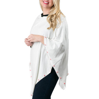 white poncho with peppermint candy button trim