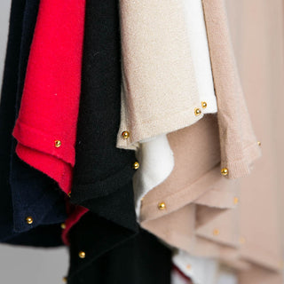 all six colors of Carol Poncho showing close-up of gold stud beads along the trim