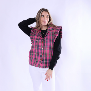 Woman in pink plaid Scottie Vest with ruffle shoulders, styled with white pants.