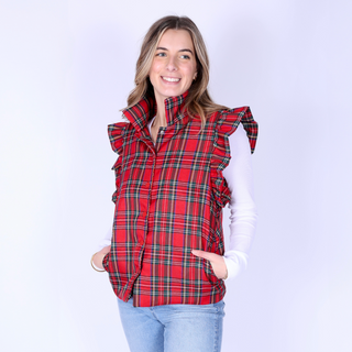 Woman modeling Scottie Plaid Vest in vibrant red plaid with ruffle trim and pockets.