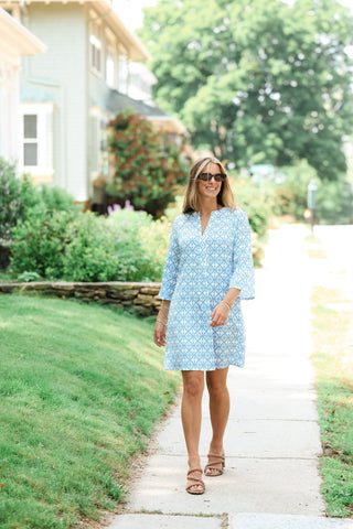 Mira Dress styled with accessories in vibrant blue print for summer