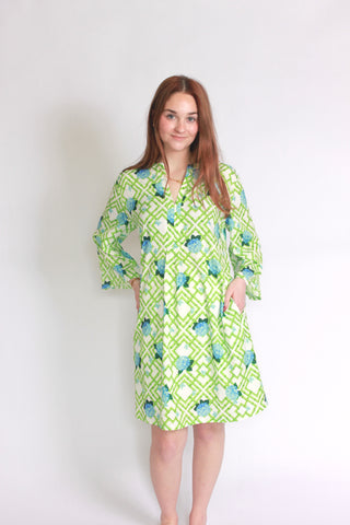 Woman wearing a hydrangea bamboo patterned bell sleeve dress