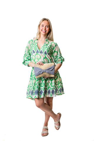 Green, cream, and navy abstract tiered long sleeve tunic dress with a split neck and tassel ties