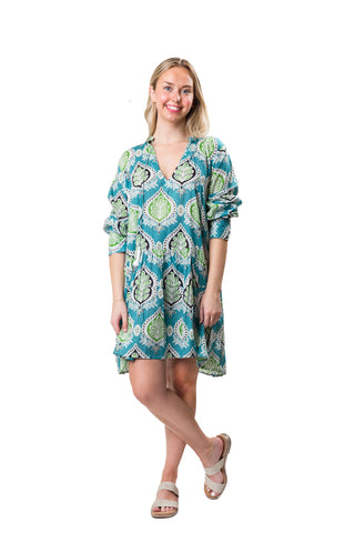 Turquoise and green medallion pattern tiered long sleeve tunic dress with a split neck and tassel ties