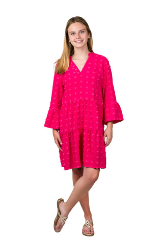 Women wearing hot pink swing dress with swiss dots