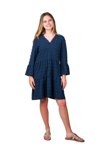 Women wearing navy swing dress with swiss dots