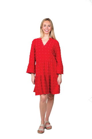 Women wearing red swing dress with swiss dots