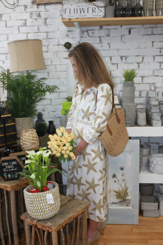 woman wearing sequin starfish lennon dress in a flower shop