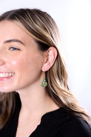 woman wearing Green Pair: "Festive green Christmas Tree Earrings with colorful accents and pearl details – holiday dangle jewelry"