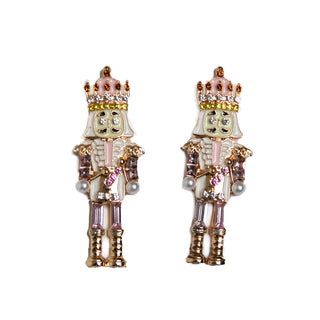 Close-up of festive pink Nutcracker Earrings with sparkling details, a whimsical holiday jewelry accessory for women.