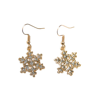 Silver Snowflake Earrings: Close-up of silver snowflake dangle earrings with glitter accents, perfect for holiday outfits.