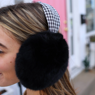 Black and white houndstooth earmuffs with black faux fur ear covering