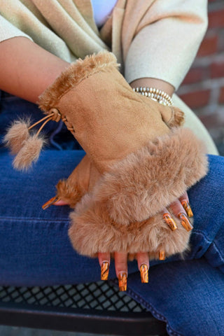 Woman wearing camel fingerless gloves