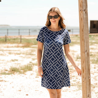 Woman wearing blue and white printed dress