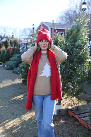 Model wearing red Poppy Scarf – chic and colorful winter accessory.
