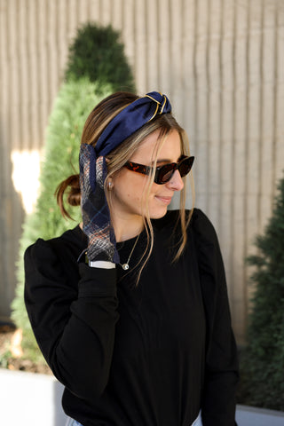 Woman wearing navy blue headband