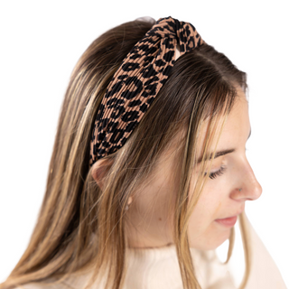 Woman wearing Galleria Knotted Leopard Headband – trendy animal print hair accessory