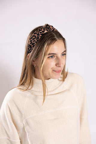 Woman wearing leopard headband 