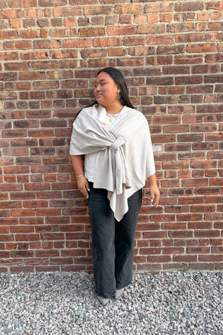 Woman wearing reversible khaki colored keyhole wrap