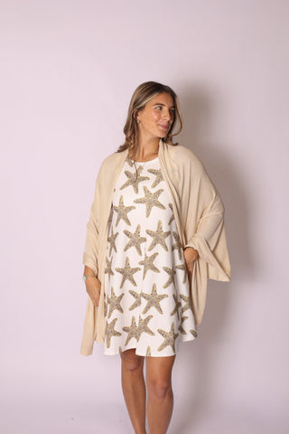 Woman wearing sand colored shawl