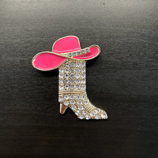 Pink enamel cowgirl hat on gold boot-shaped brooch with clear rhinestones