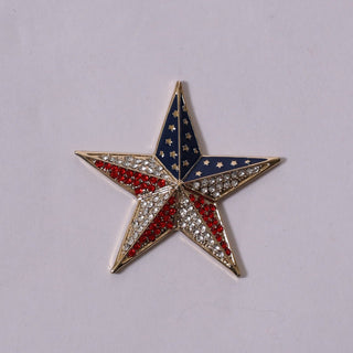 Gold star-shaped magnetic brooch with red and white rhinestones and blue enamel