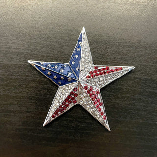Silver star-shaped magnetic brooch with red and white rhinestones and blue enamel
