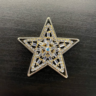 Gold star-shaped brooch with clear, and AB rhinestones
