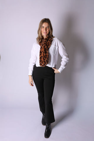 Model wearing Mina Faux Fur Keyhole Scarf in classic brown leopard print faux fur