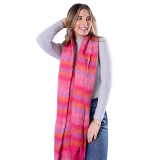 Woman wearing a colorful striped scarf on a white background