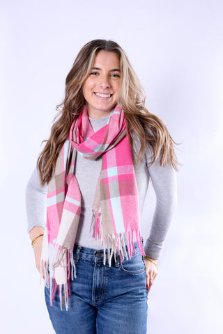 Close-up of the Ivy Scarf in pink plaid with fringe