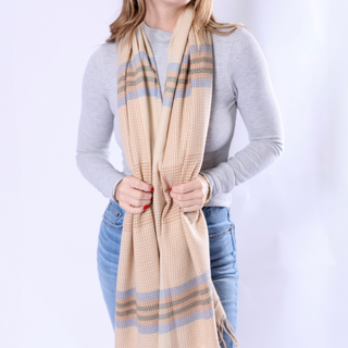 Model wearing Camille Scarf in camel plaid, over a gray long-sleeve top.
