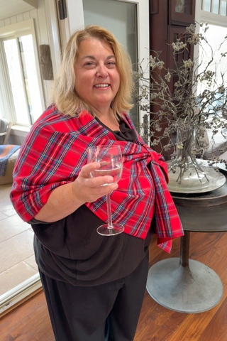 Woman wearing red tartan plaid claire wrap