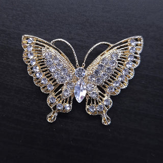 Gold butterfly brooch with rhinestones