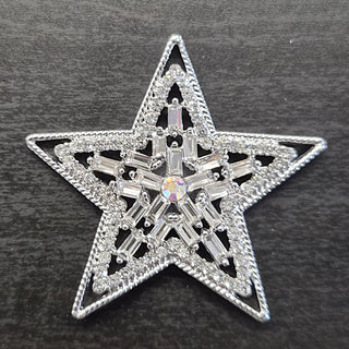 Silver star-shaped brooch with clear, and AB rhinestones