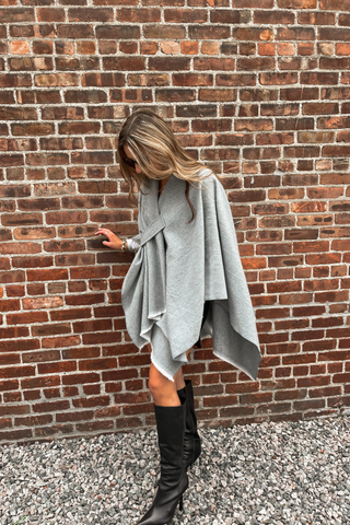Woman wearing gray oversized keyhole wrap