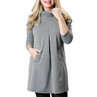 Light gray houndstooth print jacquard knit tunic dress with three quarter sleeves, turtleneck and front pleat