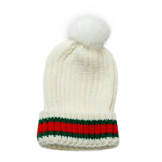 White knit hat with red and green stripe and white faux fur pom pom.