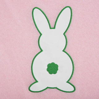Pink One Size Poncho with white and green faux leather bunny, close up