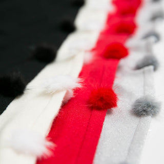 close up view of multiple colors of faux fur detail of Jackie Pom Pom Poncho