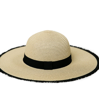 Natural wide brimmed hat with black ribbon on crown and black eyelash trim on brim