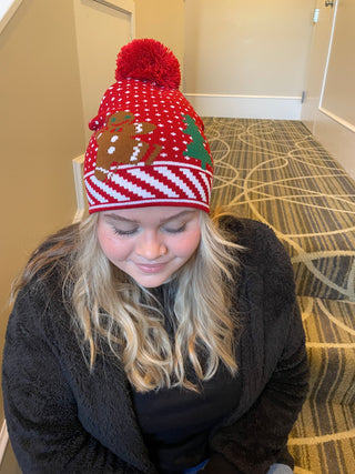 Red Pom Pom Hat with Dancing Gingerbread Cookie Man on model