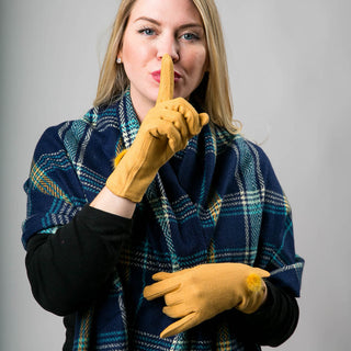 navy, green and mustard plaid Lynn scarf with fringe with yellow gloves