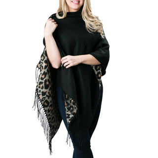 solid black poncho wrap with buttons that reverses to camel leopard